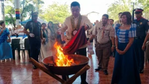 Mayor Frederick W. Siao and local officials hoisting a new Philippine flag during the 128th National Flag Day ceremony in Iligan City.