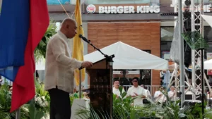 Cagayan de Oro City Mayor Rolando Klarex Uy speaks from a podium during his fourth State of the City Address at Plaza Divisoria.