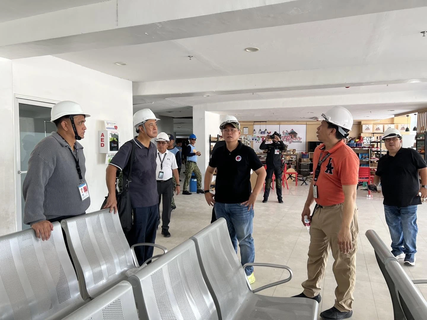 Transportation Secretary Banoy Lopez and DOTr officials inspect structural cracks at General Santos International Airport after the Mindanao earthquake.