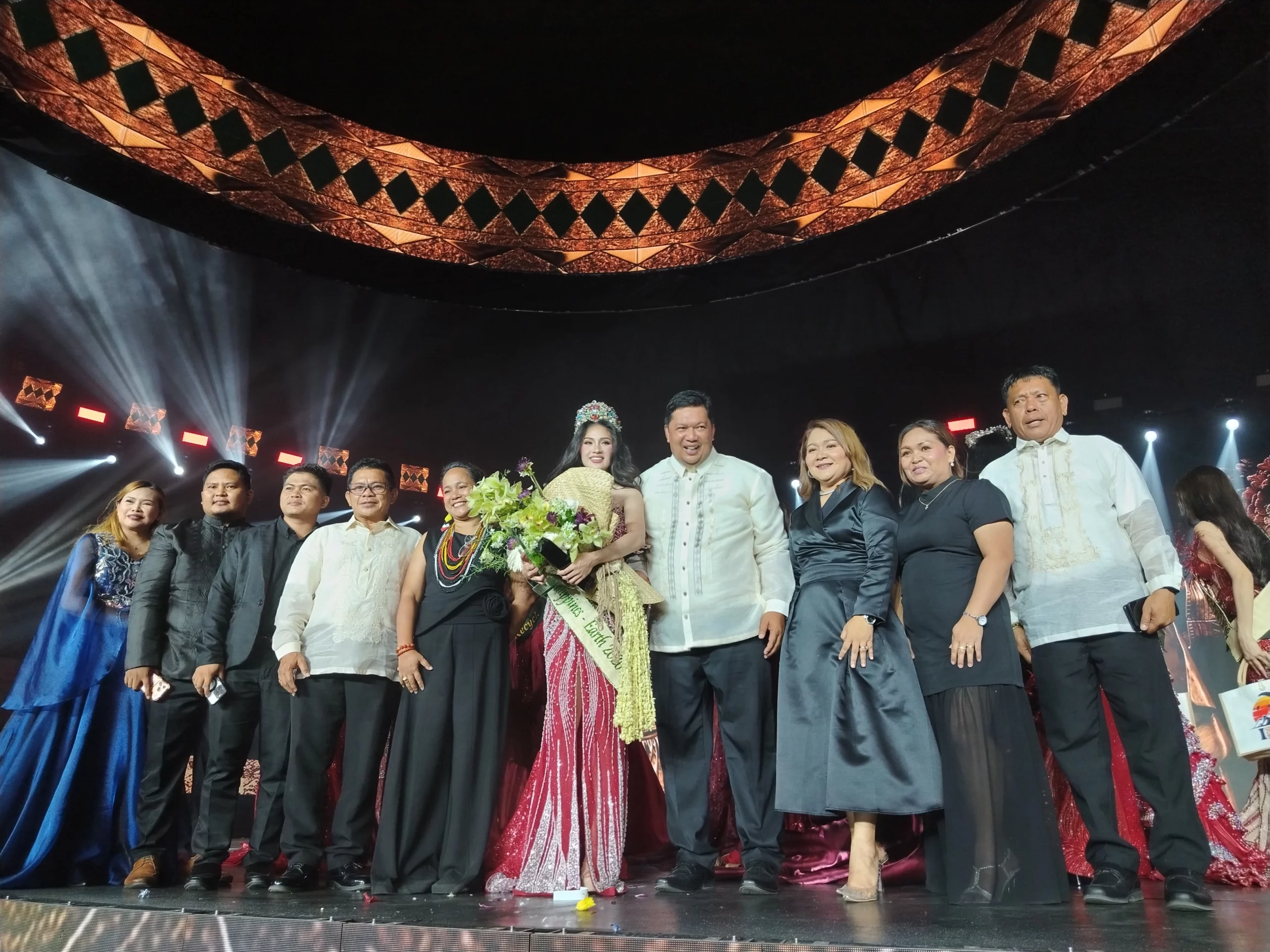 A large crowd fills the illuminated interior of the Cultural Center in Malitbog, Bukidnon during the Miss Philippines Earth 2026 coronation night stage event.