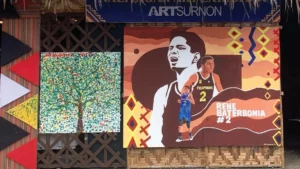 A mural depicting Agusan del Sur basketball icon Rene Baterbonia with indigenous art at the Naliyagan Art Exhibition.