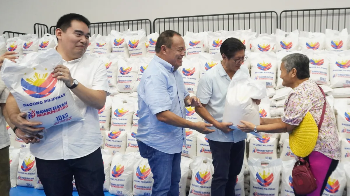 RICE TURNOVER: President Ferdinand R. Marcos Jr., joined by Camiguin officials, leads the ceremonial distribution of rice assistance under the second tranche of the Bagong Pilipinas Rice Program at the New Camiguin Gymnasium in Mambajao on July 13. (Photo courtesy of LELA/PIA-10)