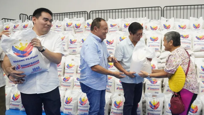 RICE TURNOVER: President Ferdinand R. Marcos Jr., joined by Camiguin officials, leads the ceremonial distribution of rice assistance under the second tranche of the Bagong Pilipinas Rice Program at the New Camiguin Gymnasium in Mambajao on July 13. (Photo courtesy of LELA/PIA-10)