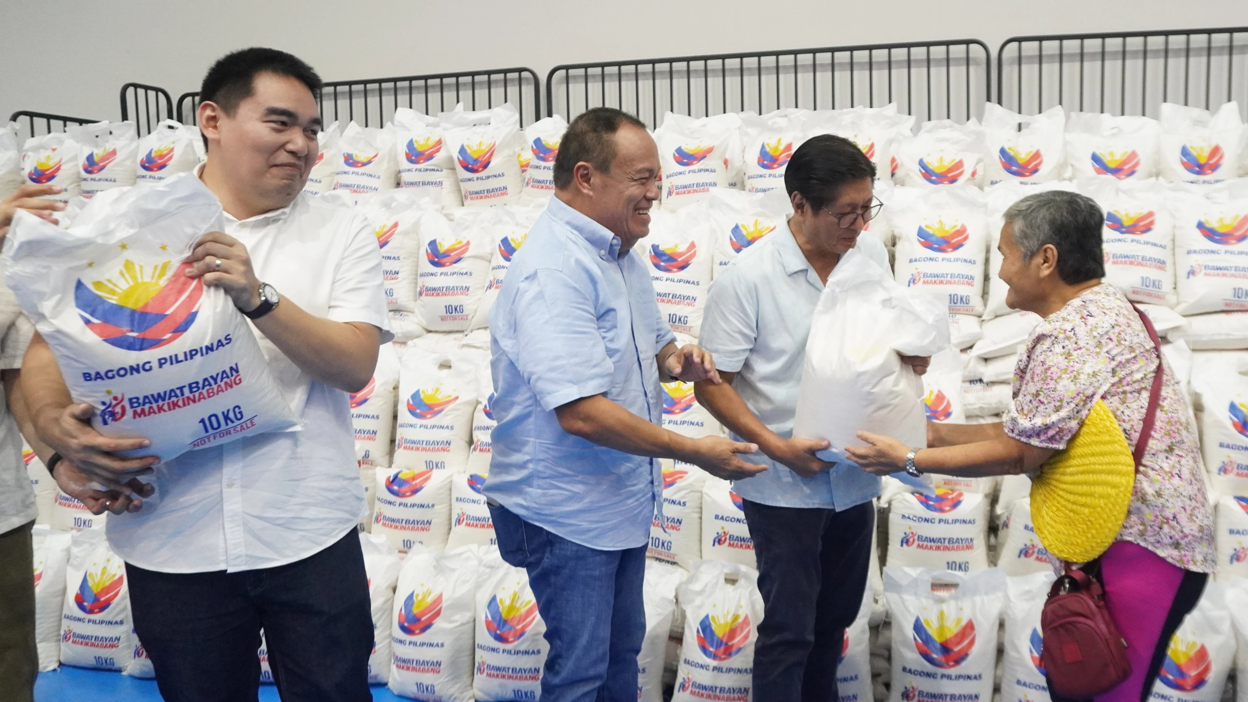 RICE TURNOVER: President Ferdinand R. Marcos Jr., joined by Camiguin officials, leads the ceremonial distribution of rice assistance under the second tranche of the Bagong Pilipinas Rice Program at the New Camiguin Gymnasium in Mambajao on July 13. (Photo courtesy of LELA/PIA-10)
