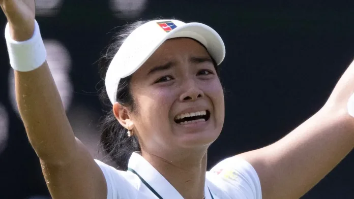 Philippine tennis player Alex Eala hits a forehand return on Centre Court during her historic women's singles match at the 2026 Wimbledon Championships.