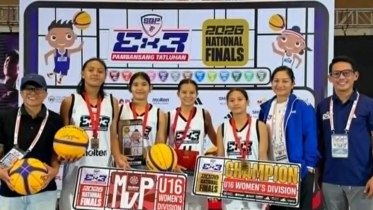Members of the Cagayan de Oro under-16 women's basketball team from Corpus Christi School hold up their championship trophy and pose together at SM Center Muntinlupa.