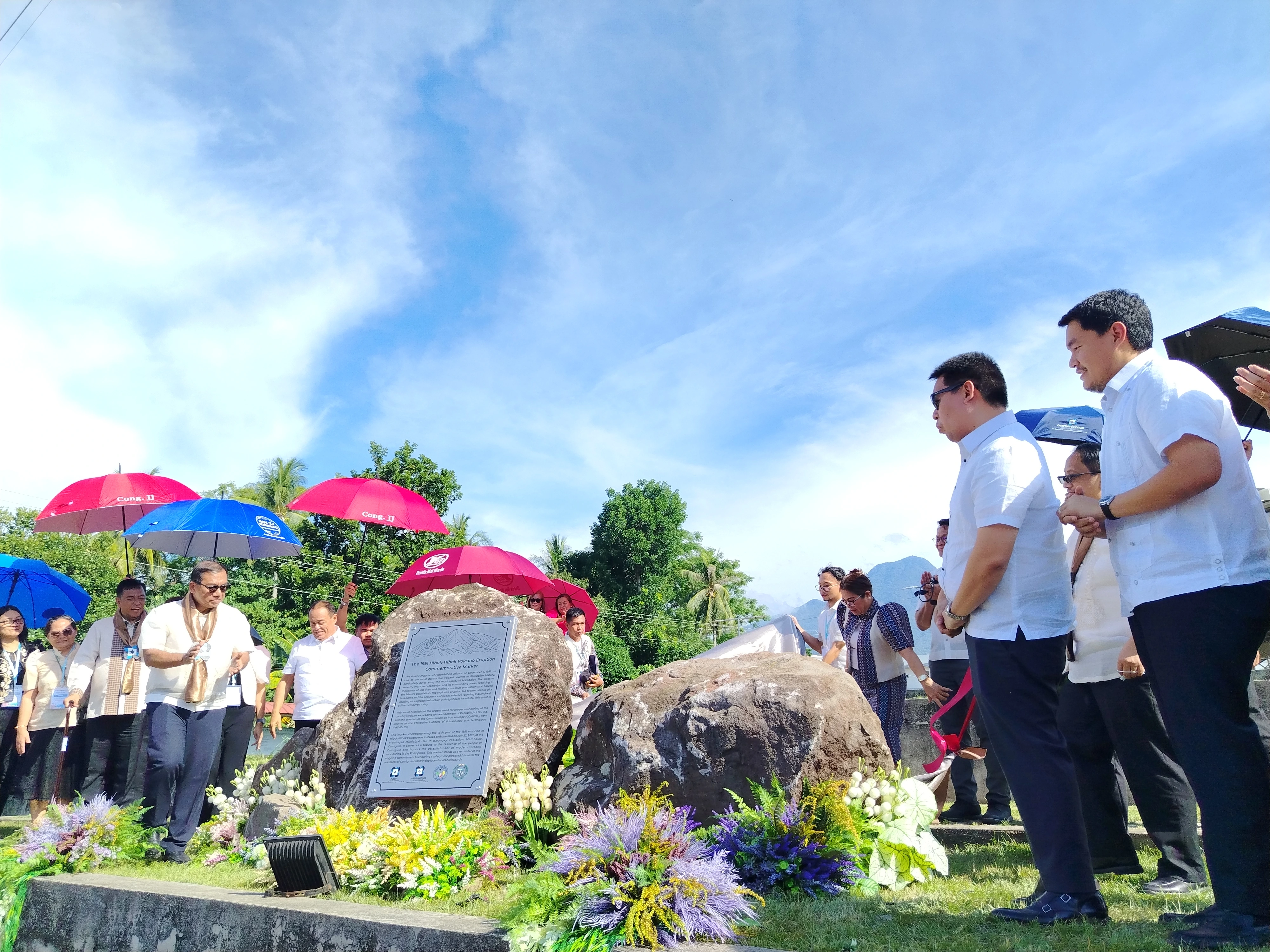 Officials including DOST Secretary Renato U. Solidum Jr. and Camiguin Gov. Xavier Jesus Romualdo reveal a historical marker commemorating the 1951 eruption of Mt. Hibok-Hibok during the opening of Regional Science, Technology and Innovation Week in Mambajao, Camiguin, on July 22, 2026. The unveiling highlighted how scientific advancements and volcano monitoring have strengthened community resilience since the tragedy. (Photo by Shiela Mae Butlig)