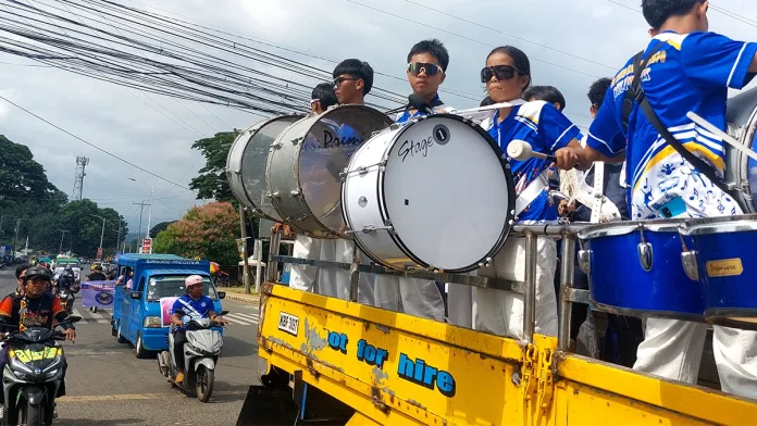 MARCHING IN CELEBRATION: The Gingoog Christian College Band performs during the Civic-Military Motorcade on July 20, one of the highlights of the month-long celebration of the 66th Gingoog City Charter Day and the 47th Grand Kaliga Festival. Photo by Edwin Iyo