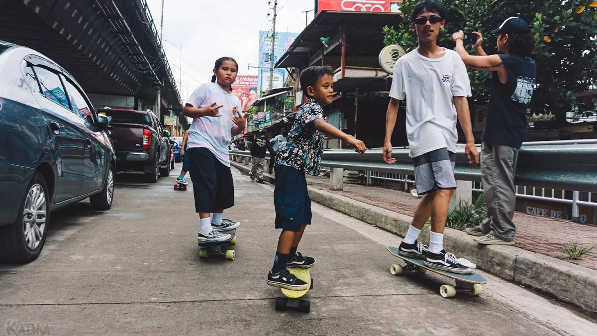 Aspiring street athletes navigate makeshift city tracks during the global Go Skateboarding Day 2026 event. Winning 25 titles in three years without a single hometown ramp, Cagayan de Oro's young skateboarders are fighting for public training spaces, petitioning the City Council for interim parks to train on. (Photo courtesy of Mychal Q. Redoblado with Kaima Films)
