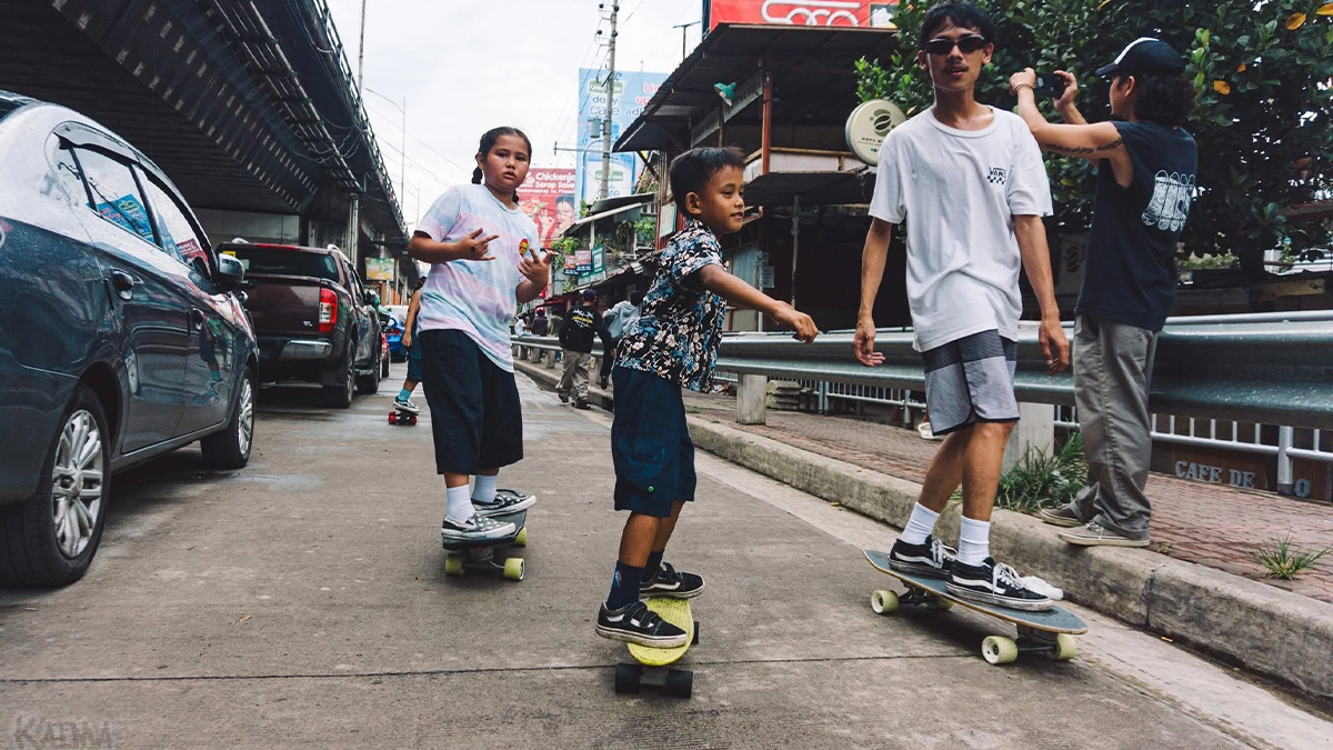 Aspiring street athletes navigate makeshift city tracks during the global Go Skateboarding Day 2026 event. Winning 25 titles in three years without a single hometown ramp, Cagayan de Oro's young skateboarders are fighting for public training spaces, petitioning the City Council for interim parks to train on. (Photo courtesy of Mychal Q. Redoblado with Kaima Films)