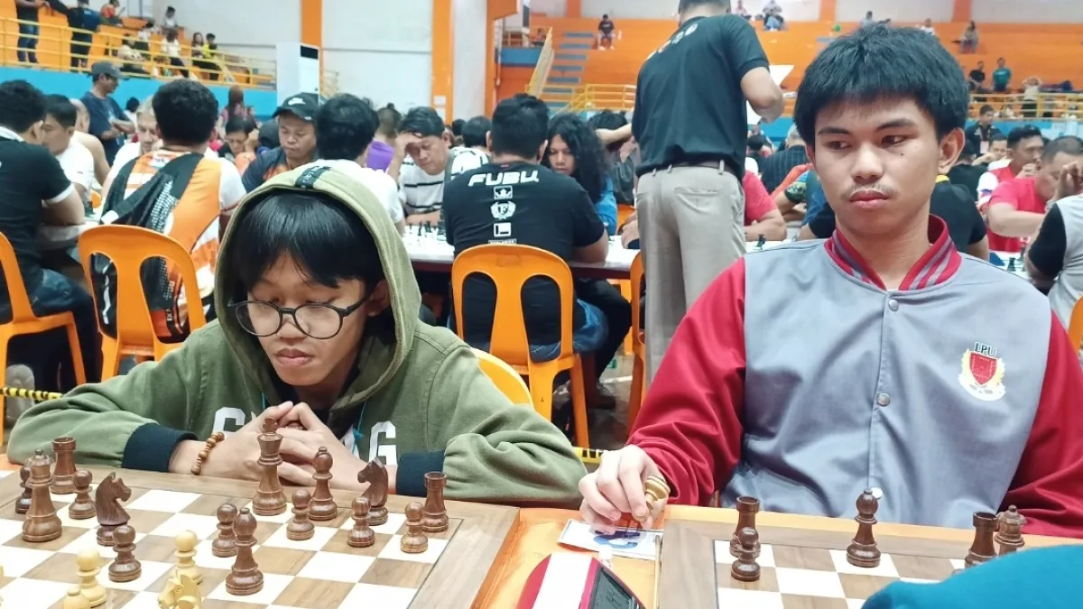 Arena International Master Miykael Jerahmiel Lapad of Laguindingan, left, matches wits with National Master Keith Adriane Ilar of Maramag, Bukidnon, during the Gov. Henry S. Oaminal Open Chess Championships 2026 in Ozamiz City, Monday, July 13, 2026. The high-profile tournament gathered elite chess prodigies and master-rated players from across Northern Mindanao. (Photo by Lynde Salgados)