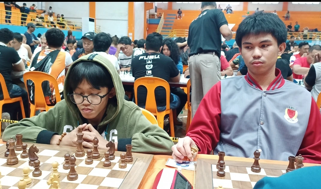 Arena International Master Miykael Jerahmiel Lapad of Laguindingan, left, matches wits with National Master Keith Adriane Ilar of Maramag, Bukidnon, during the Gov. Henry S. Oaminal Open Chess Championships 2026 in Ozamiz City, Monday, July 13, 2026. The high-profile tournament gathered elite chess prodigies and master-rated players from across Northern Mindanao. (Photo by Lynde Salgados)