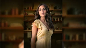A promotional headshot of actress Max Collins posing professionally against a neutral studio background, illustrating her career transition into global cinema markets.