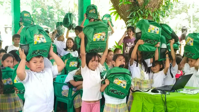 BACK-TO-SCHOOL HELP | Young learners from beneficiary schools in Iligan City and Lanao del Norte receive NGCP school kits filled with essential learning supplies. The annual Gamit ni Bulilit program supports pupils from host communities while promoting transmission line safety among students, parents, and teachers. (Photo courtesy of Abaga Integrated School and Rupagan Elementary School)
