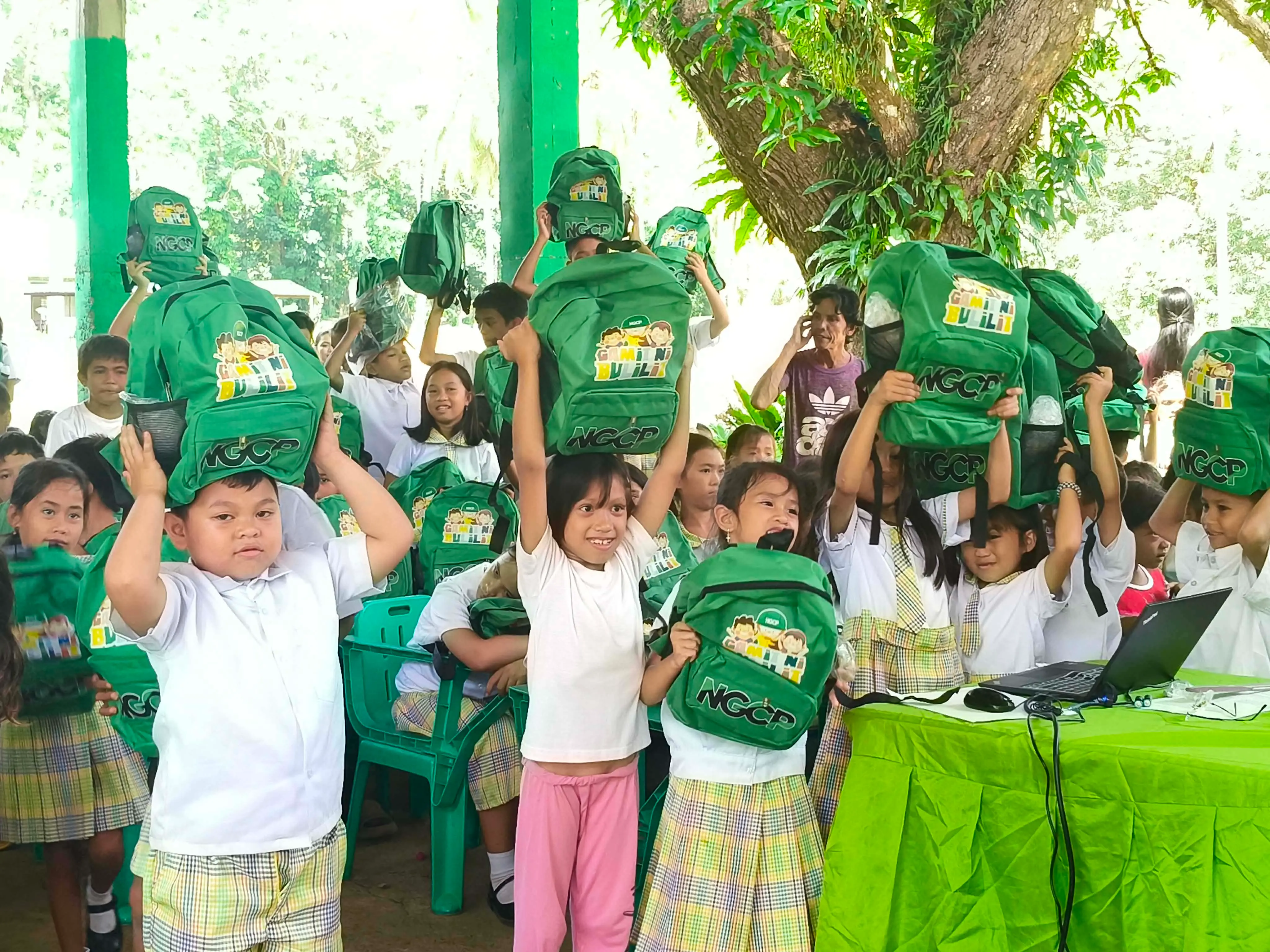 BACK-TO-SCHOOL HELP | Young learners from beneficiary schools in Iligan City and Lanao del Norte receive NGCP school kits filled with essential learning supplies. The annual Gamit ni Bulilit program supports pupils from host communities while promoting transmission line safety among students, parents, and teachers. (Photo courtesy of Abaga Integrated School and Rupagan Elementary School)