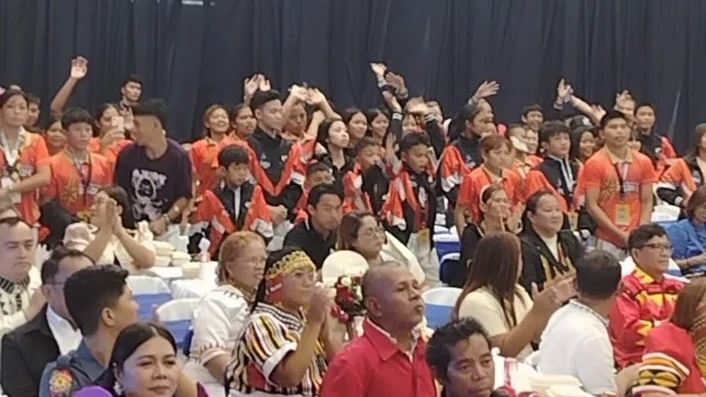 Northern Mindanao student-athletes smile while holding up cash incentive envelopes during the 145th Regional Development Council meeting in Cagayan de Oro City.