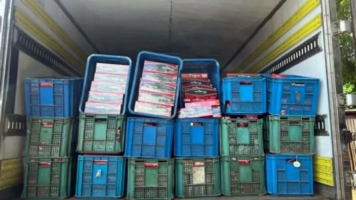 Law enforcement personnel from Police Regional Office 10 and the Iligan City Police Office display confiscated illegal cigarettes following an operation along the National Highway in Barangay Dalipuga, Iligan City. Officers seized an estimated 1.2 million pesos worth of smuggled tobacco products during the anti-smuggling intervention on July 16, 2026. (Photo courtesy of PRO-10 Regional Public Information Office)