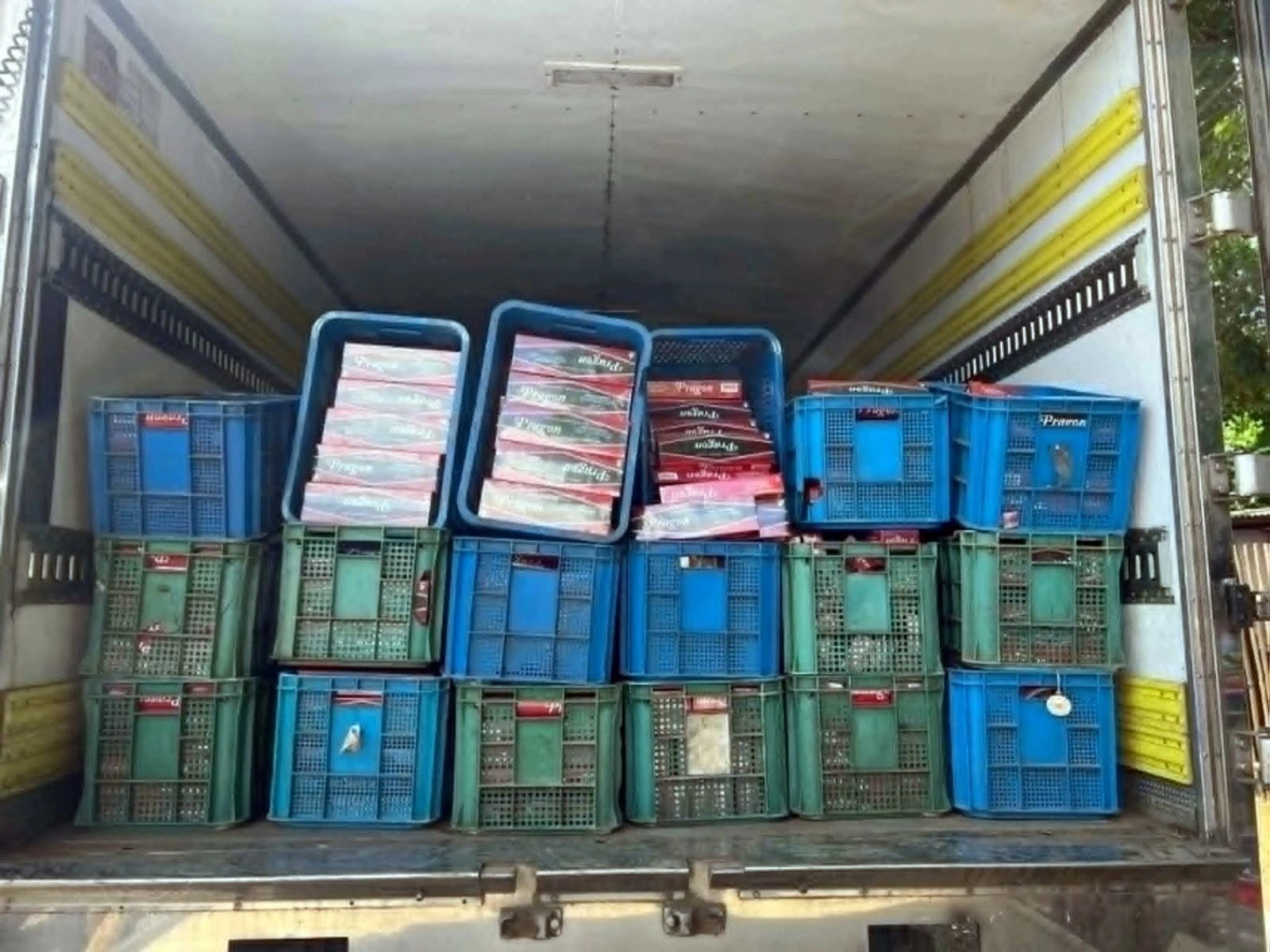 Law enforcement personnel from Police Regional Office 10 and the Iligan City Police Office display confiscated illegal cigarettes following an operation along the National Highway in Barangay Dalipuga, Iligan City. Officers seized an estimated 1.2 million pesos worth of smuggled tobacco products during the anti-smuggling intervention on July 16, 2026. (Photo courtesy of PRO-10 Regional Public Information Office)