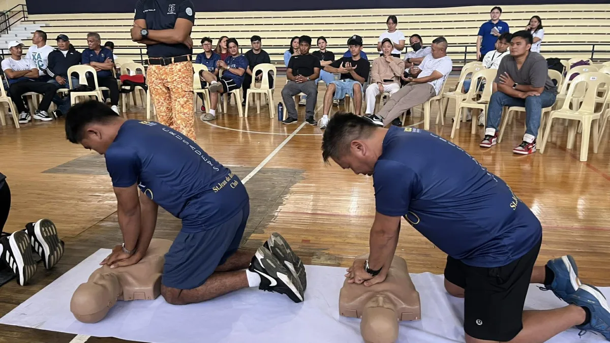 Xavier University athletic coaches practice cardiopulmonary resuscitation techniques on training manikins during the opening day of a Basic Life Support training seminar at the XU Gym in Cagayan de Oro City on Saturday, July 11, 2026. The program aimed to equip sports personnel with essential emergency response skills to handle medical crises during campus athletic events. (Photo by Jaime Joshua A. Frias II)