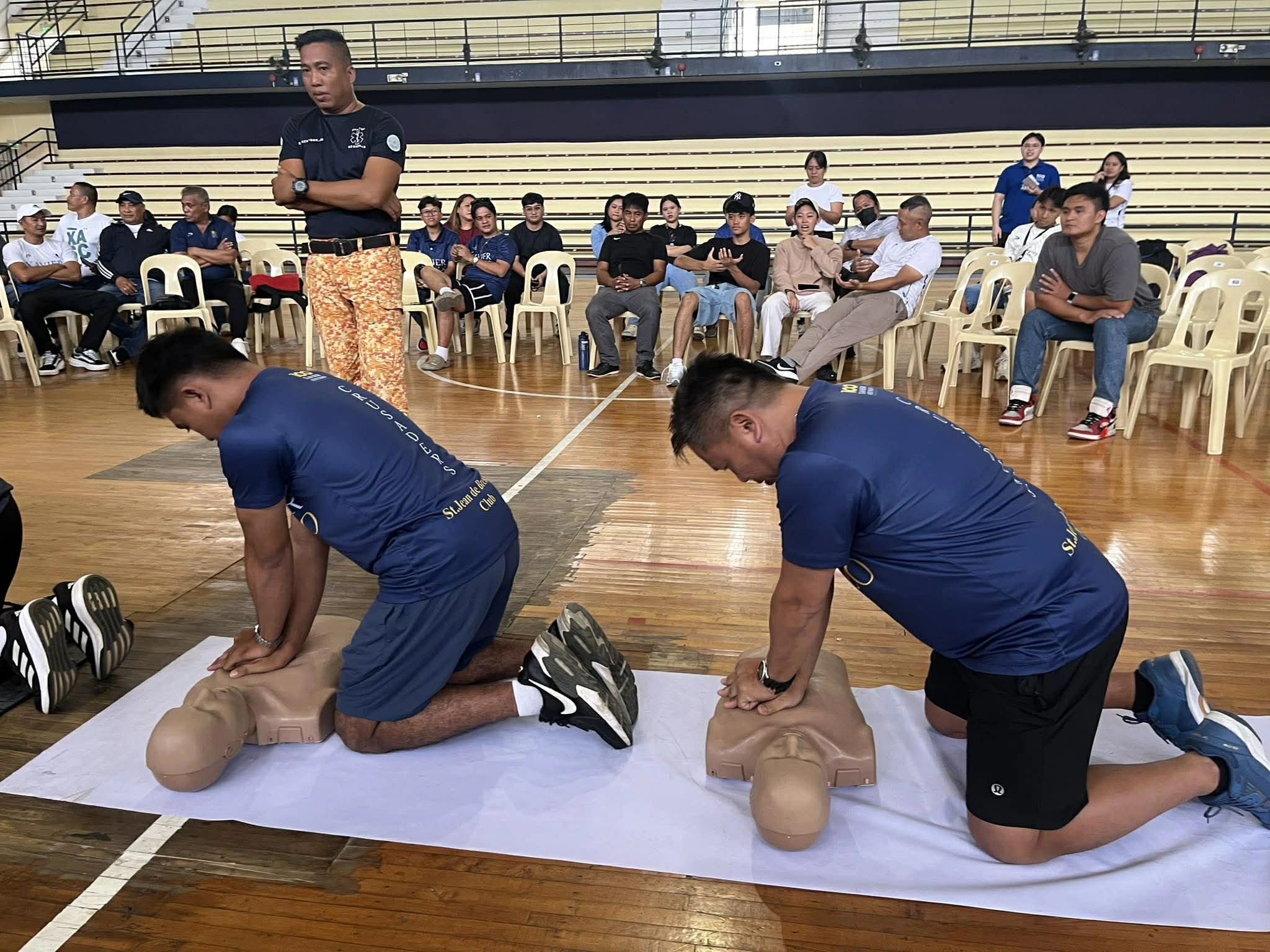 Xavier University athletic coaches practice cardiopulmonary resuscitation techniques on training manikins during the opening day of a Basic Life Support training seminar at the XU Gym in Cagayan de Oro City on Saturday, July 11, 2026. The program aimed to equip sports personnel with essential emergency response skills to handle medical crises during campus athletic events. (Photo by Jaime Joshua A. Frias II)