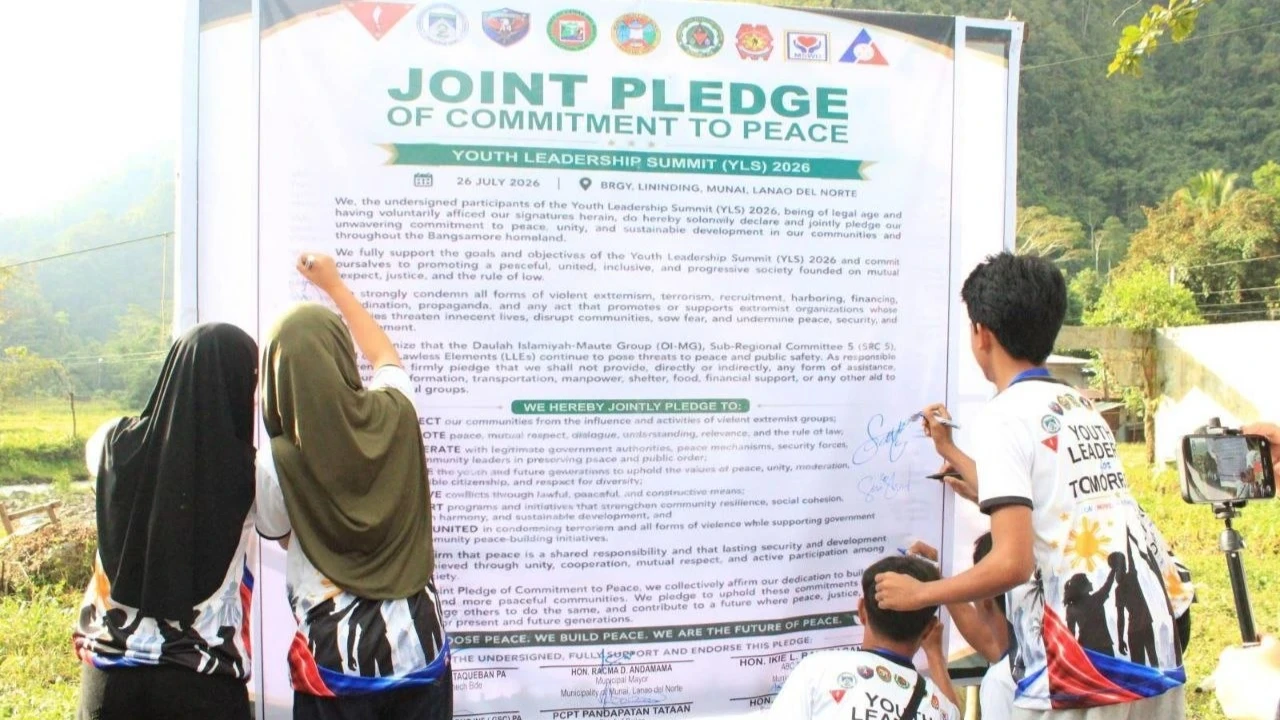 PEACE PLEDGE. Participants sign a Peace Covenant during the Youth for Peace Youth Leadership Summit in Munai, Lanao del Norte, on Sunday, July 26, 2026. The three-day event, held from July 24 to 26, brought together local youth to pledge their commitment against violence and illegal activities while promoting unity and responsible leadership.