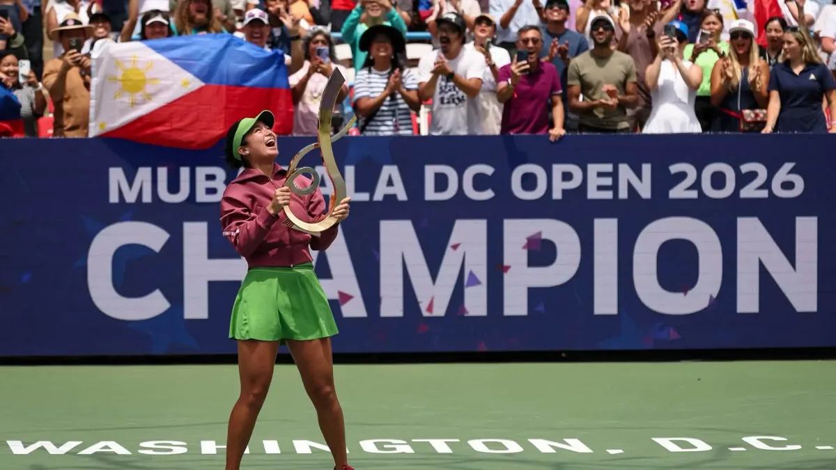 Alex Eala cheers exuberantly while holding her trophy high in front of supportive fans and a Philippine flag following her final victory on Tuesday, Aug. 4, 2026 (PH TIME. The 21-year-old dedicated her inaugural WTA Tour singles title to her family, training team, and the Filipino community worldwide. (Photo courtesy of WTA Facebook page)