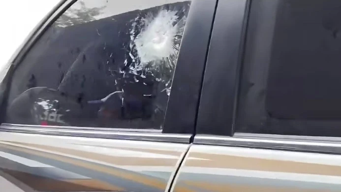 CONVOY ATTACK: A shattered window with a bullet hole is seen on a vehicle belonging to Bangsamoro Autonomous Region in Muslim Mindanao (BARMM) Interim Chief Minister Abdulraof Macacua’s convoy following an ambush by unidentified gunmen along the General Santos-Cotabato road in Maguindanao del Norte on Saturday. (Photo screen grabbed from DXMY Cotabato)