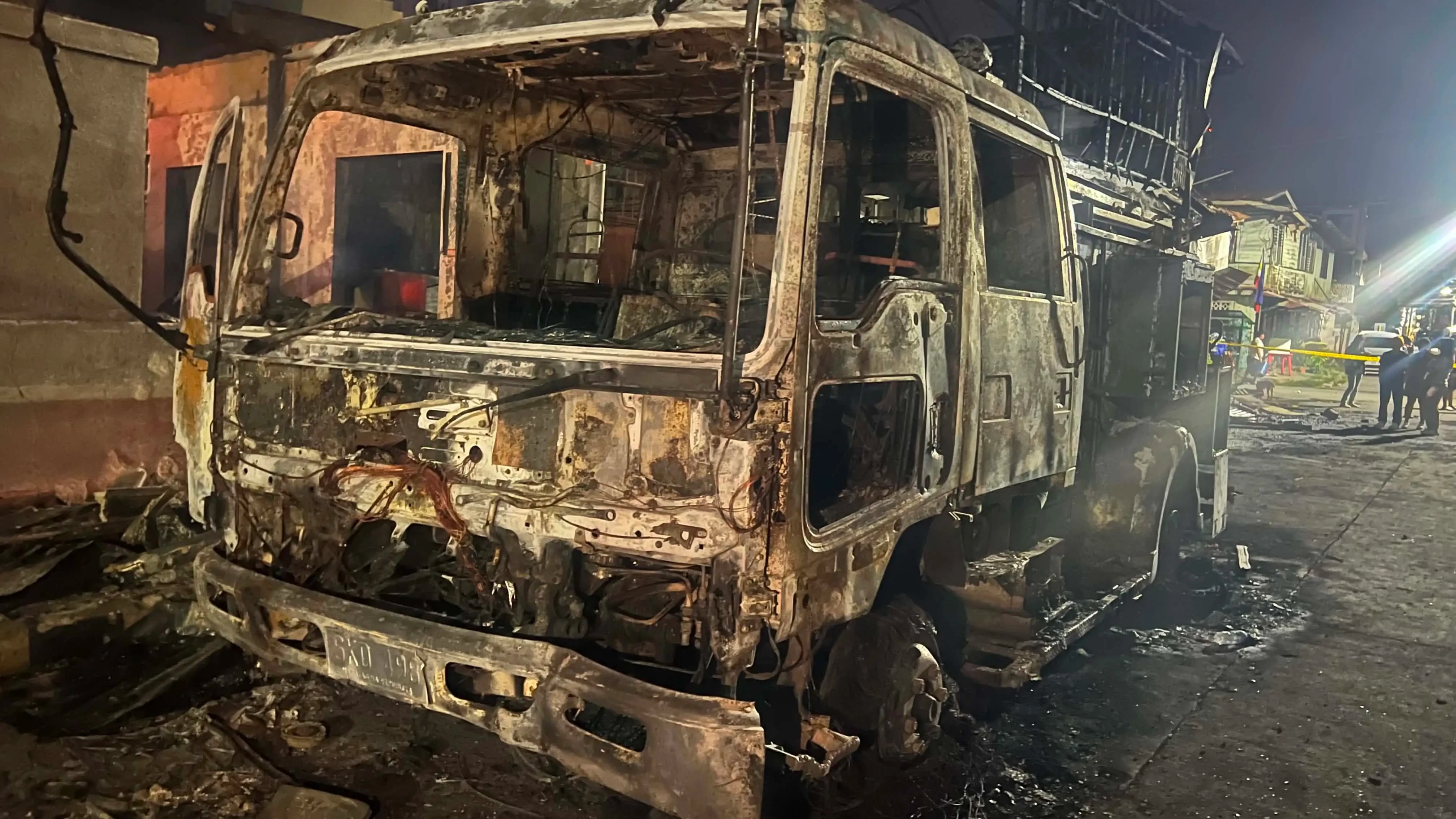 A Bureau of Fire Protection Station 1-A fire truck sits severely damaged after being engulfed by flames while firefighters responded to a four-alarm residential fire in Burgos, Barangay 7, Cagayan de Oro City on Tuesday, Aug. 4, 2026. The blaze destroyed seven houses, damaged three other structures, partially burned the Barangay 7 Hall, and displaced 24 families. (Photo courtesy of Angie Alsado)