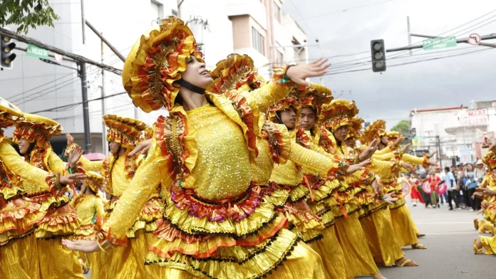 Street dancers wearing elaborate yellow costumes perform along city streets during a previous edition of the Higalaay Festival in Cagayan de Oro City. City organizers announced a month-long schedule for Higalaay 2026, leading up to the signature Higalaay Streetdancing Competition on Aug. 26 as contingents parade from Limketkai Center to Pelaez Sports Center. (File Photo courtesy of Cagayan de Oro City Information Office)