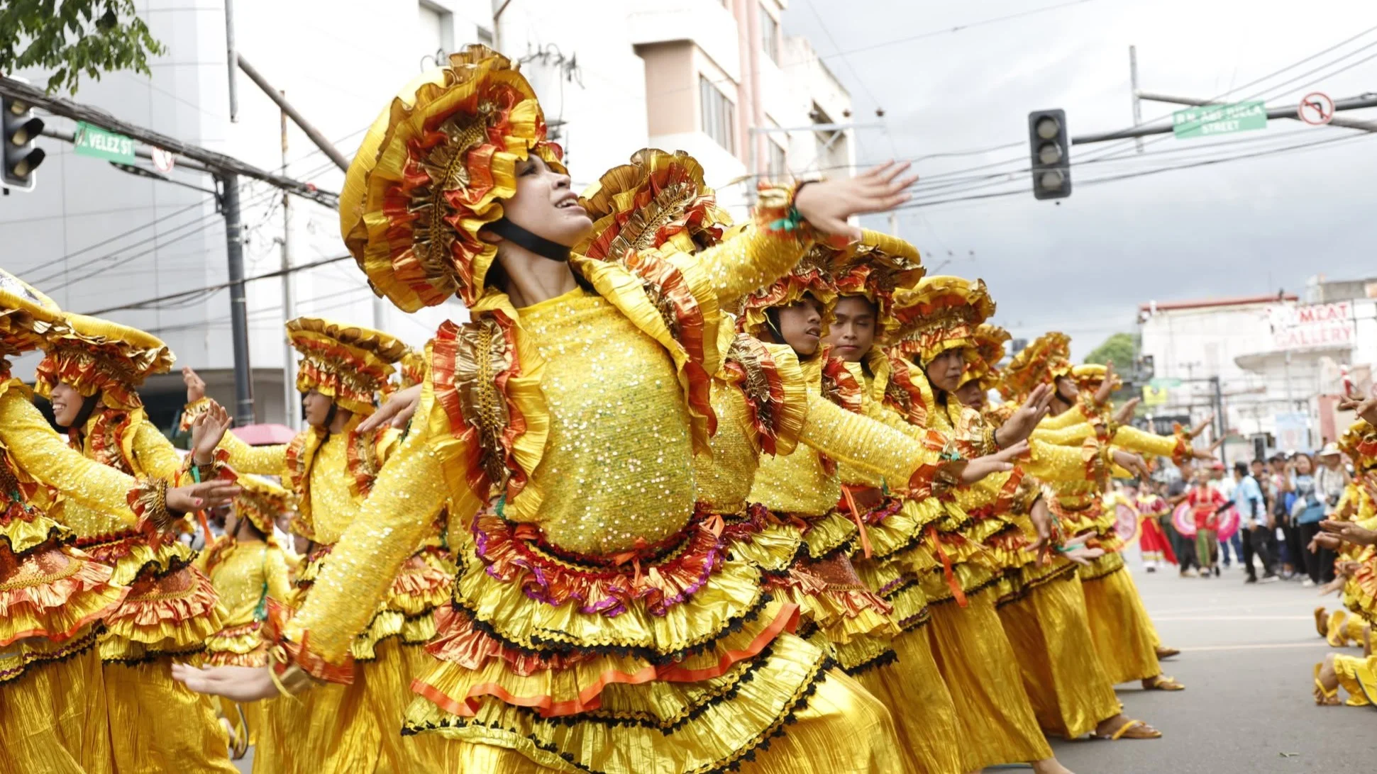 Street dancers wearing elaborate yellow costumes perform along city streets during a previous edition of the Higalaay Festival in Cagayan de Oro City. City organizers announced a month-long schedule for Higalaay 2026, leading up to the signature Higalaay Streetdancing Competition on Aug. 26 as contingents parade from Limketkai Center to Pelaez Sports Center. (File Photo courtesy of Cagayan de Oro City Information Office)