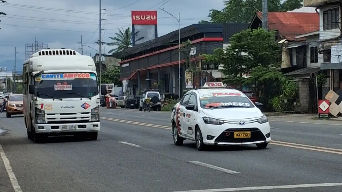 A provincial bus travels along the national highway in Cagayan de Oro City, as local authorities initiate a month-long dry run of the city's revised traffic scheme. The pilot implementation tests a long-delayed traffic ordinance designed to manage public utility vehicle flow along major thoroughfares. (Photo by Ben Balce)