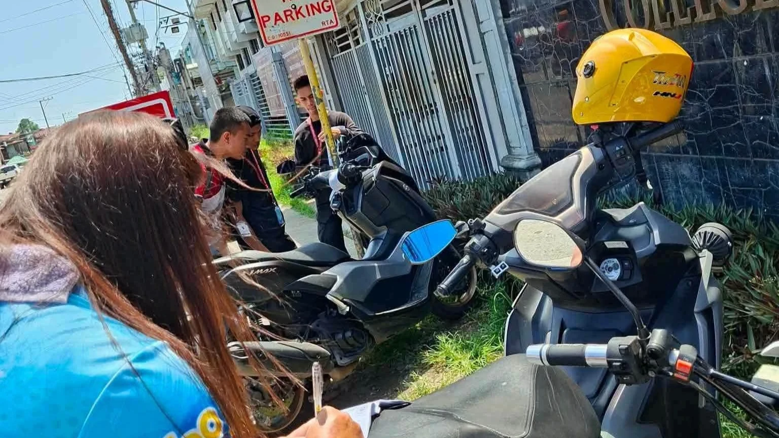 Personnel of the Cagayan de Oro City Roads and Traffic Administration (RTA) conduct a road clearing operation along a major thoroughfare. The action is part of the local government's intensified enforcement campaign against illegal parking to keep public roads unobstructed. (Photo courtesy of the Cagayan de Oro City Information Office)