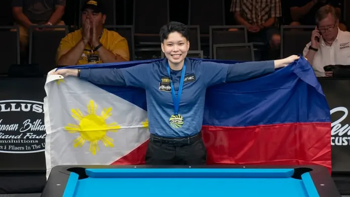 Chezka Centeno smiles proudly while holding open the Philippine flag following her championship match victory on Tuesday, Aug. 4, 2026. The Zamboanga City billiards star dedicated her world 8-ball victory to her late mother, Josephine, who passed away three months prior to the tournament. (Photo courtesy of WPA)