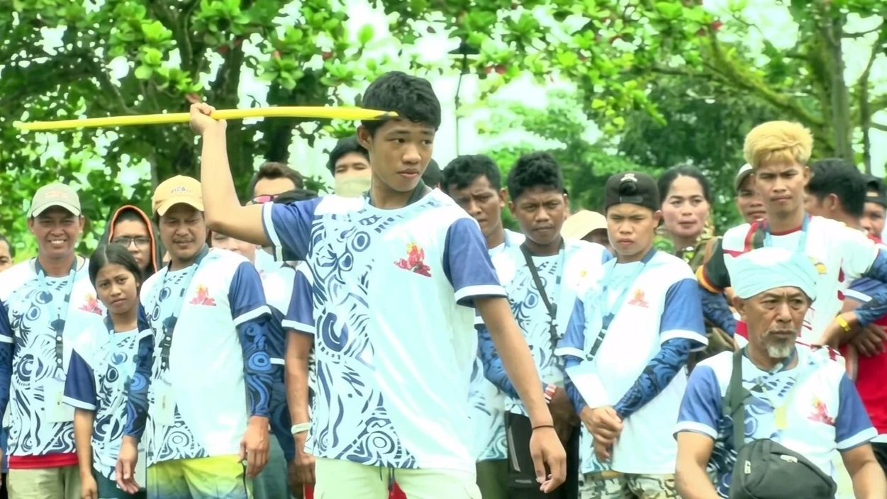 A participant competes in pagpilak (traditional spear throwing) during the 2025 Indigenous Peoples Games in San Agustin, Surigao del Sur. Over 350 tribal athletes gathered for the Philippine Sports Commission (PSC) event to preserve cultural heritage and promote grassroots athletics during the 11th Kalumonan Festival. (Screengrabbed from PTV News)