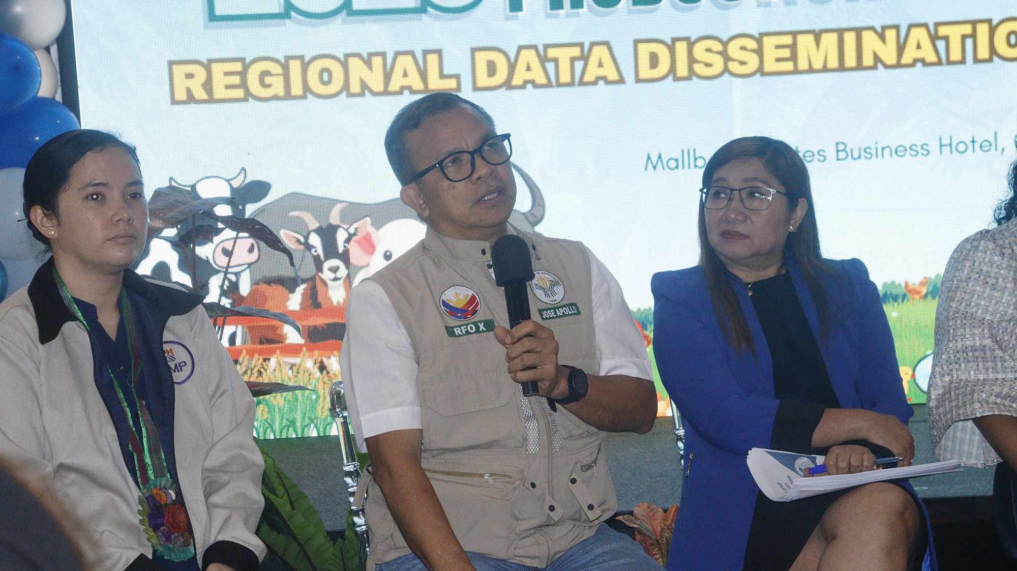 AGRICULTURAL BOOST: Department of Agriculture Region 10 (DA-10) Executive Director Jose Apollo Y. Pacamalan, center, speaks during the Regional Data Dissemination Forum at Mallberry Suites Business Hotel in Cagayan de Oro City. Seated beside him are Stephanie C. Tomarong, left, OIC of BFAR-10's Planning, Monitoring, and Evaluation Unit, and fellow panel members. (Photo courtesy of PSA 10)