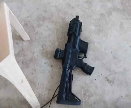 RECOVERED FIREARM. Police present one of the two firearms allegedly used in the shooting at Zamboanga National High School. (Screengrab from ANC video)