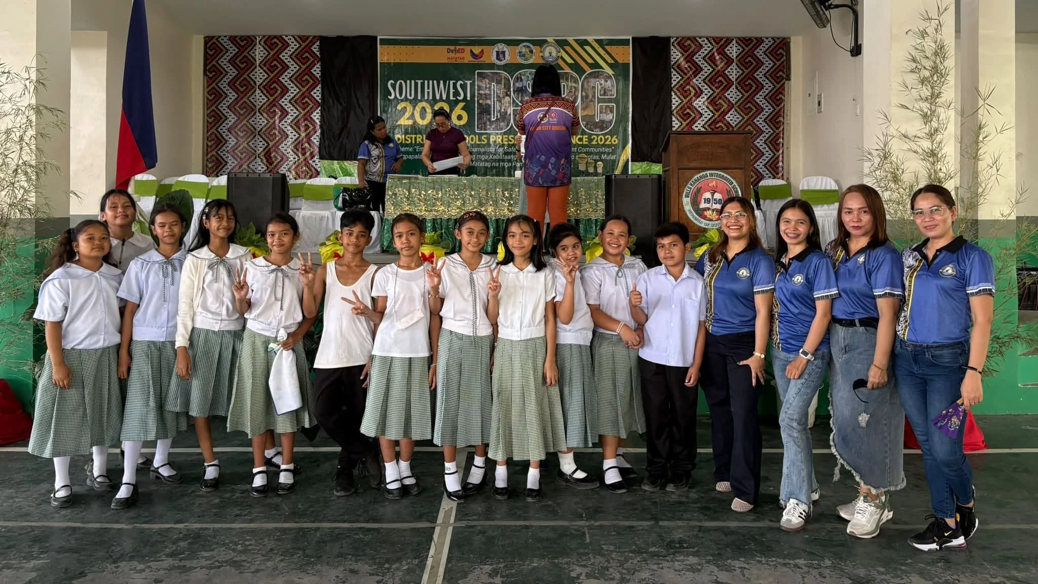 PRESS CONFERENCE WINNERS: Student journalists from San Vicente Elementary School pose with their paper advisers and coaches during the Southwest District Schools Press Conference 2026 at Villa Kananga Integrated School in Butuan City on Friday, Aug. 14, 2026. The campus journalism team won 13 awards out of 14 contested events, qualifying five pupil-journalists to advance to the upcoming Division Press Conference. (Photo courtesy of San Vicente Elementary School)