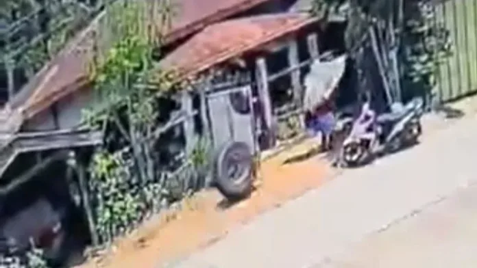 A screenshot from a video shows a detached tire from the tractor head of a trailer speeding toward former Gingoog City councilor Avelino “Tsamba Lang” Bernaldez 67, who was carrying an umbrella near the gate of his residence along the highway in Barangay Santiago, Gingoog City, on August 26, 2026. The tire struck Bernaldez, who was later declared dead at a hospital in Gingoog City. Photo Supplied.