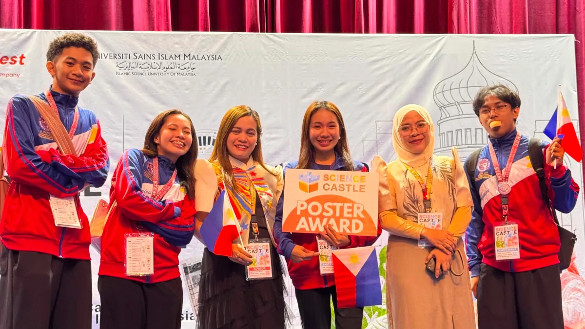 INTERNATIONAL INNOVATORS: Student researchers and faculty coaches from Acelo C. Badelles Sr. Memorial High School (ABMHS) in Iligan City celebrate on stage after winning awards at the Science Castle Asia 2026 competition at Universiti Sains Islam Malaysia in Kuala Lumpur on Aug. 28, 2026. (Photo Courtesy of Josevi D. Macas)