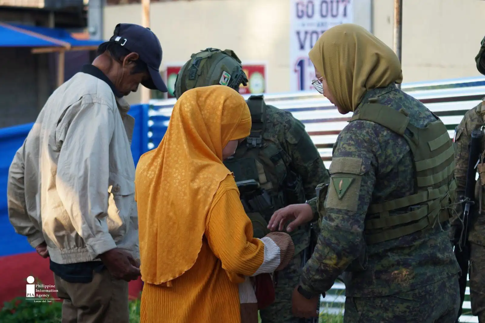 SECURITY CHECK. Security personnel check a voter before allowing entry to a polling center during the Bangsamoro parliamentary elections on Sept. 14 in Lanao del Sur. The inspection was part of security measures to keep voters and election workers safe. (Photo courtesy of JAKA/PIA-10/Lanao del Sur)