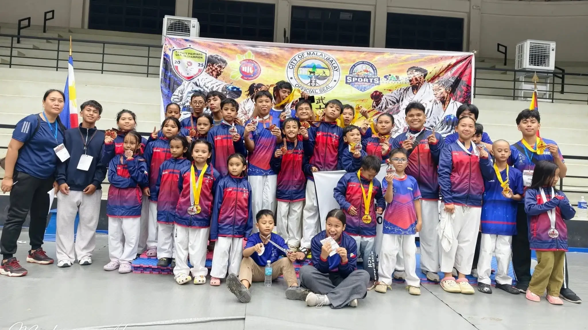 Bukidnon Martial Arts and Defense Academy (BMDA) athletes and head Sensei Michael Pabillore pose at the Malaybalay City Karatedo Championship in Bukidnon. BMDA gold medalists Ethan Jeade P. Leo, Gabrielle Q. Balquedra, Leirian Gabrielle Obsioma, Erle Matthew Redoble, Caleb Bacay, Jeiro Ortega, Kevin Calipayan, and Crischia Okit led the 36-medal tally in Northern Mindanao. Photo Courtesy of BMDA
