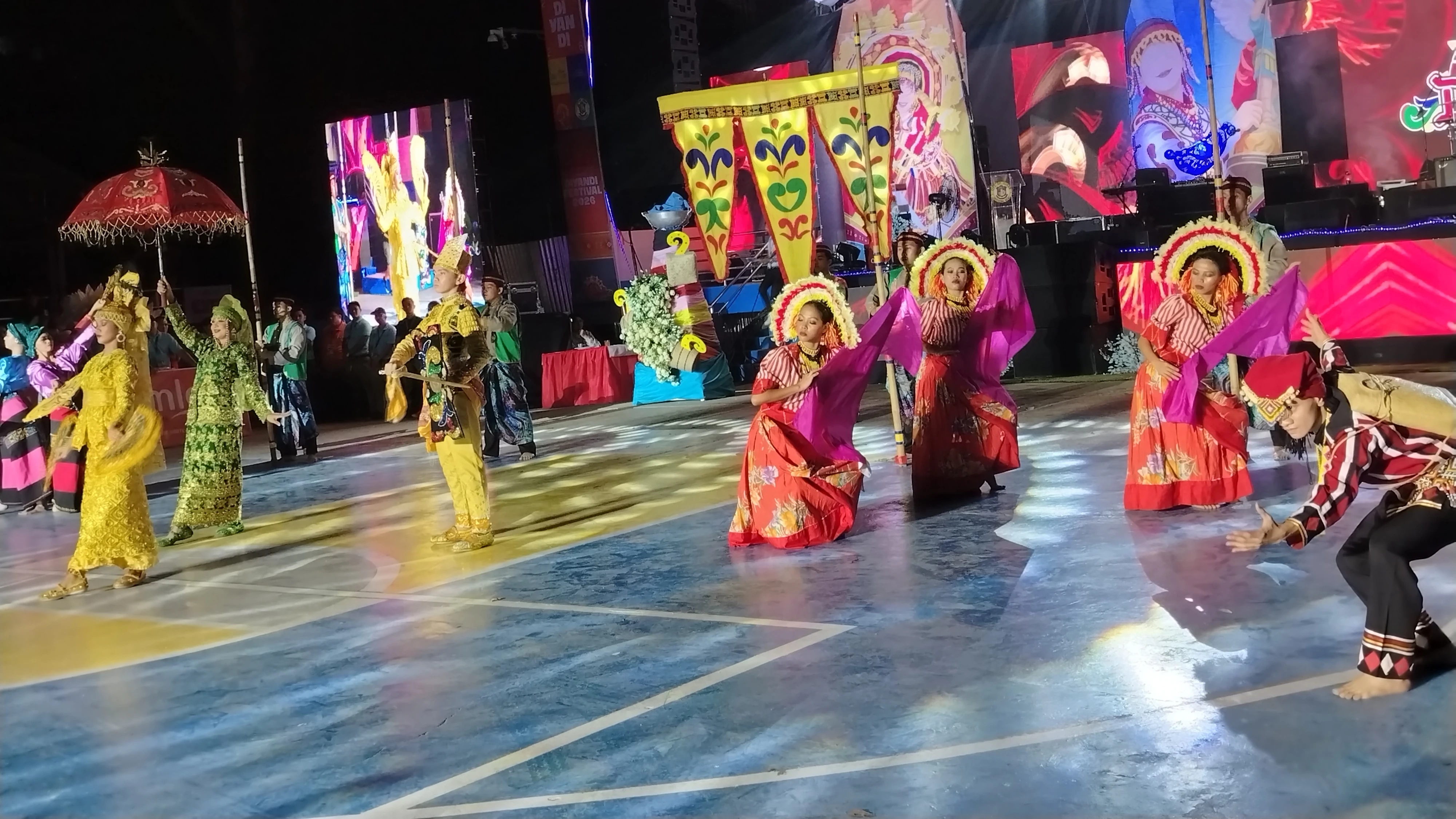 CULTURAL UNITY: Performers in traditional attire showcase the tri-people heritage of Iligan City during the Diyandi Festival on a lit outdoor stage. The month-long festival celebrates the shared culture, faith, and peaceful co-existence of Iligan’s Higaonon, Maranao, and Christian communities in honor of the city's patron, Saint Michael the Archangel. (Photo by Bonita L. Ermac)