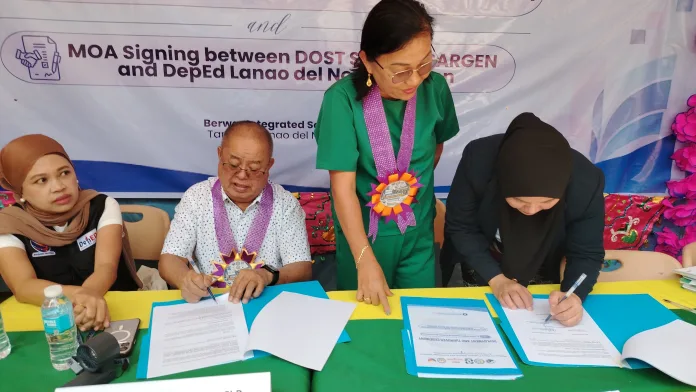 DOST SOCCSKSARGEN and DepEd Lanao del Norte formalize a partnership for the eTuro Digital Learning System turnover at Berwar Integrated School in Tangkal, Lanao del Norte. The MOA signing expands digital learning resources for public schools in the region. (Photo by Bonita L. Ermac)