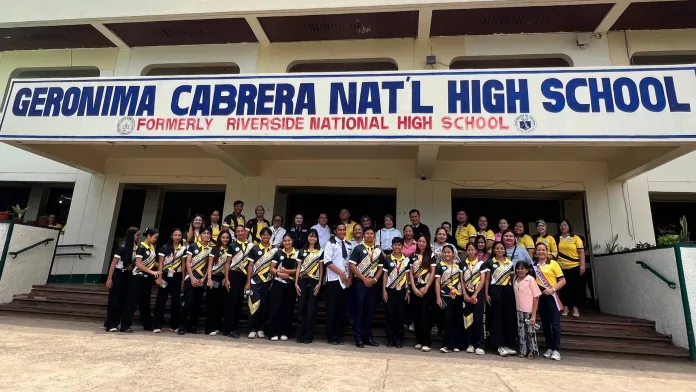 Grade 12 students from Kolambugan attending LGU work immersion during a municipal flag ceremony.