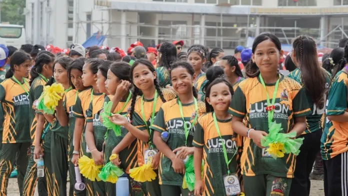 Lupon Green Warriors student-athletes assemble for the Davao Oriental Provincial Athletic Meet in Cateel. Supported by Lupon Mayor Santos “Sonny” Alonzo Jr. and host Cateel Mayor Emilou C. Nuñez, Lupon topped the provincial sports meet with 80 gold medals. (Photo courtesy of Provincial Government of Davao Oriental)