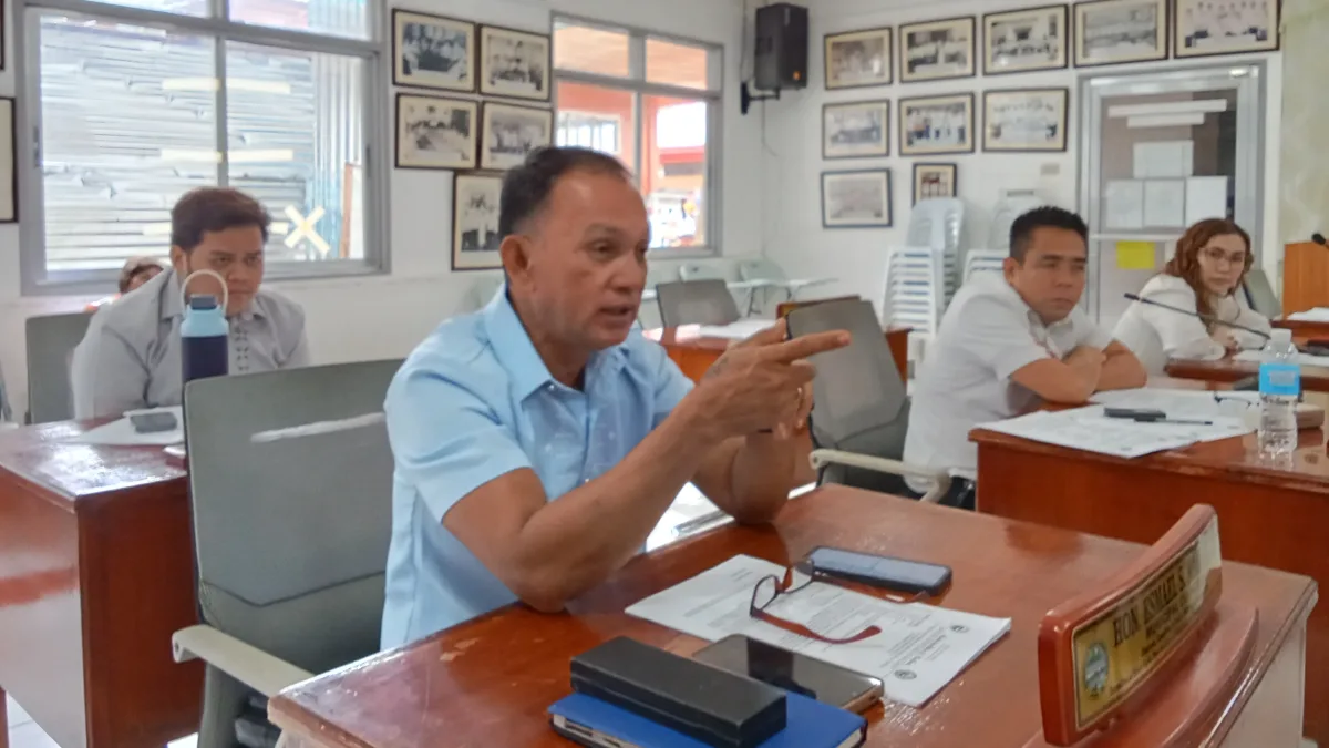 Councilor Esmael Naguib Jr. speaks during a regular session of the Sangguniang Bayan in Medina, Misamis Oriental, discussing legal frameworks for "bao-bao" and tricab transport units.