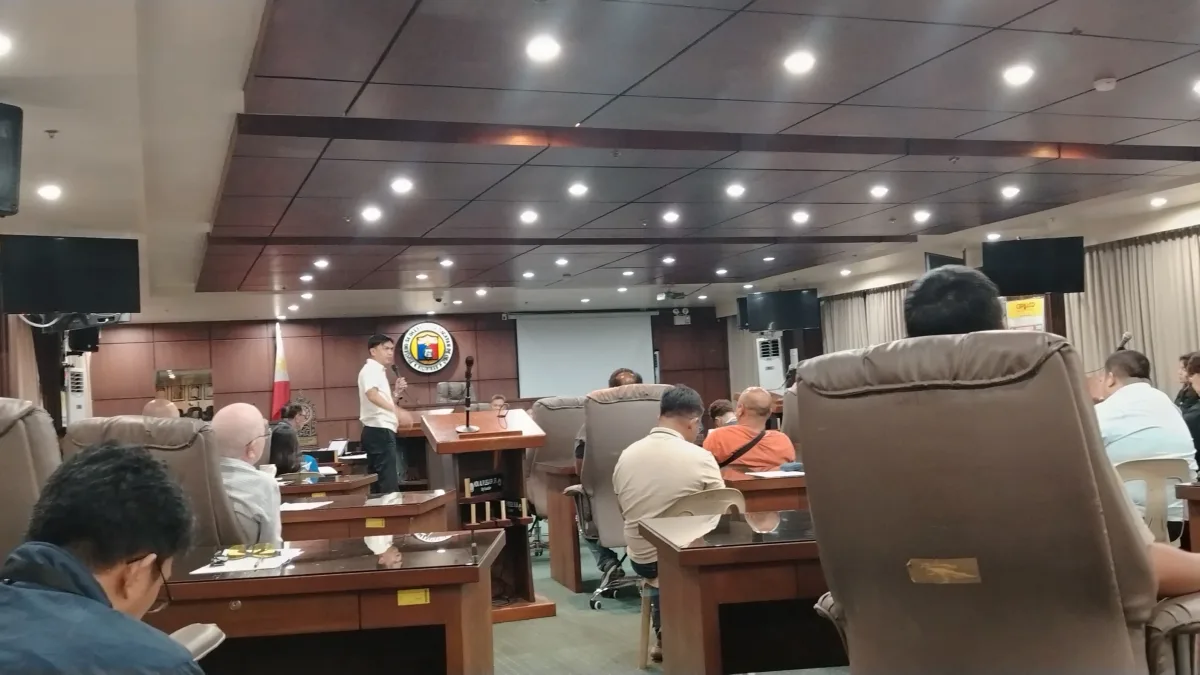 Opol Mayor Jay Francis Bago addresses the Cagayan de Oro City Council at the podium during a committee session on September 23 regarding provincial PUV route restrictions.
