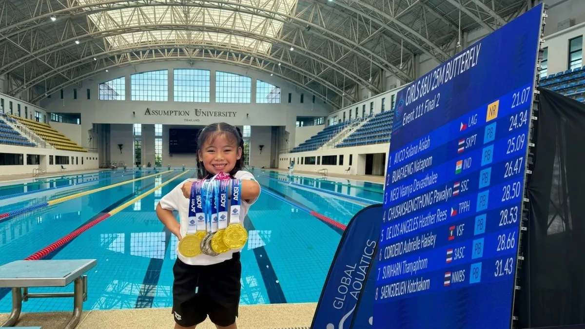 Young Philippine swimmer Solana Aislah “Daday” Ayco poses with her gold and silver medals at Assumption University in Bangkok, Thailand. The Valencia City, Bukidnon native set a tournament record of 21.07 seconds in the 25-meter butterfly during the 3rd Asian Open Schools Invitational Short Course Swimming Championships.