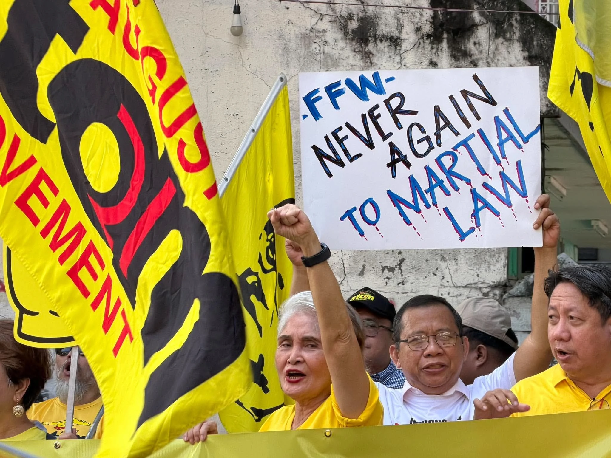 DEMOCRACY BEYOND THE BALLOT BOX — Federation of Free Workers (FFW) President Atty. Sonny Matula and members hold a “NEVER AGAIN TO MARTIAL LAW” placard during a Martial Law anniversary observance, calling for stronger unions, collective bargaining, job security and living wages. (Photo supplied)