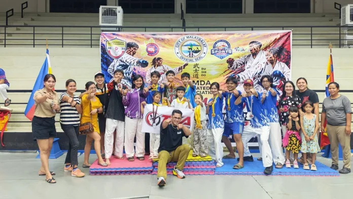 Tacurong Karatedo Association (TKA) athletes and coaches celebrate winning 16 medals at the 1st Malaybalay Bukidnon Karatedo Championship on Sept. 5, 2026. Led by Head Trainer John Robert L. Butil, the team brought honor to Tacurong City and Mayor Hon. Lina O. Montilla after sweeping Kata and Kumite events. (Photo courtesy of Tacurong Karatedo Association (TKA))